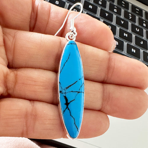 Turquoise dangle silver earrings.