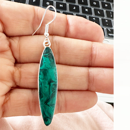 Emerald dangle silver earrings.