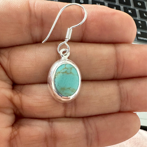 Turquoise Oval dangle silver earrings.