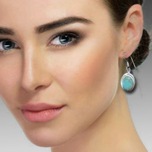 Turquoise Oval dangle silver earrings.