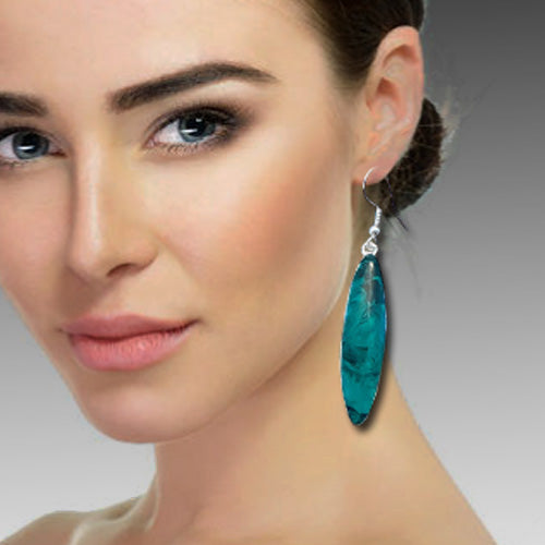 Emerald dangle silver earrings.