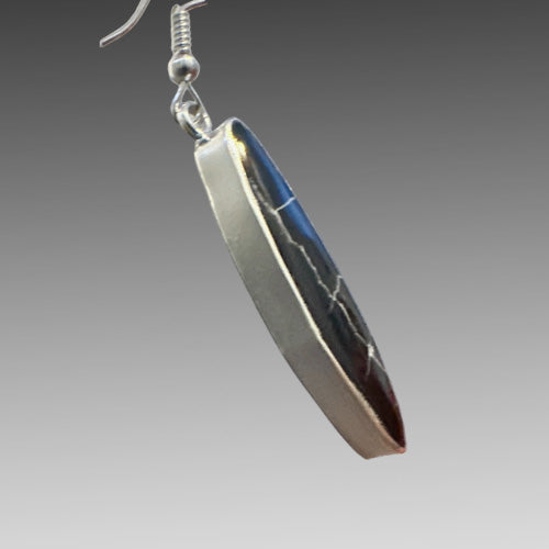 Emerald dangle silver earrings.