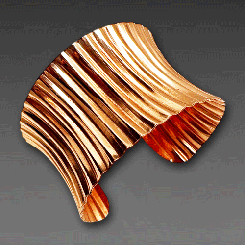 CORRUGATED COPPER ANTICLASTIC CUFF.