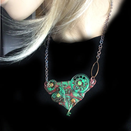 Steampunk Heart Necklace being worn on black